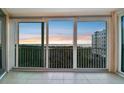 Balcony view with sliding glass doors showcasing waterfront scenery and natural sunlight at sunset at 2625 Terra Ceia Bay Blvd # 406, Palmetto, FL 34221