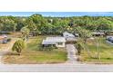 Spacious property featuring a cozy home with a metal roof and carport at 3407 Cason Rd, Plant City, FL 33566