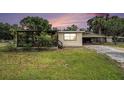 Charming single-story home with a covered porch and carport at 3407 Cason Rd, Plant City, FL 33566