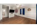 Inviting living room with wood floors, ceiling fan, and neutral paint at 3407 Cason Rd, Plant City, FL 33566