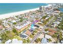 Aerial view of the property near the beach, showing its location, surrounding neighborhood, and proximity to the ocean at 3516 Casablanca Ave, St Pete Beach, FL 33706