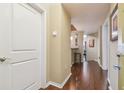Bright hallway with wood floors and white trim, leading to the living areas at 504 S Armenia Ave # 1338, Tampa, FL 33609