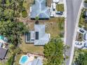 Aerial view of the property showcasing the layout, pool, and surrounding neighborhood at 5065 Shore Acres Ne Blvd, St Petersburg, FL 33703