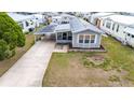An aerial shot capturing the home's covered parking and neatly kept surroundings at 5428 Joyce St, Zephyrhills, FL 33542