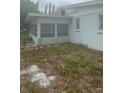 A large grassy lot on the side and back of home at 5720 21St W St, Bradenton, FL 34207