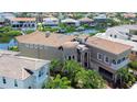 Waterfront home showcasing a tile roof and manicured landscaping at 6201 Marbella Blvd, Apollo Beach, FL 33572