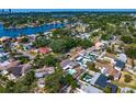 Scenic aerial view of a waterfront community showcasing homes, lush greenery, and water views at 843 37Th Ne Ave, St Petersburg, FL 33704