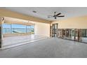 Spacious living room featuring waterfront views and tile floors ready for customization at 844 Bay Point Dr, Madeira Beach, FL 33708