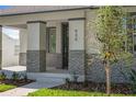Welcoming front porch with stone accents and nice landscaping at 930 57Th N Ave, St Petersburg, FL 33703