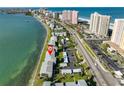 Aerial view of waterfront condo community featuring well-manicured lawns and convenient parking at 1301 Gulf Blvd # 107, Clearwater Beach, FL 33767