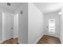 Bright entryway featuring tile-look floors, neutral paint, a closet and a storm door at 1700 Azalea Ct # B, Oldsmar, FL 34677