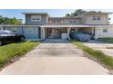 Inviting townhome with a covered carport, well-maintained lawn and vibrant landscaping at 1700 Azalea Ct # B, Oldsmar, FL 34677
