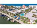 Aerial view of waterfront condo community with pool, marina and beach access perfect for a relaxing vacation at 19417 Gulf Blvd # E217, Indian Shores, FL 33785