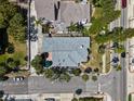 Overhead shot of a well-maintained home with a backyard patio, situated on a corner lot with palm trees at 2700 Pass A Grille Way, St Pete Beach, FL 33706
