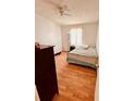 Bright bedroom featuring hardwood floors and a ceiling fan at 5407 Sweetwater Terrace Cir # 5407, Tampa, FL 33634