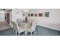 Dining room featuring a glass table and seating for six with bright walls at 5980 Shore S Blvd # 403, Gulfport, FL 33707