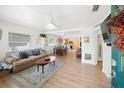 Bright living room with an open floor plan, flowing into the dining area and kitchen at 6535 3Rd S Ave, St Petersburg, FL 33707