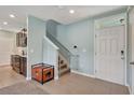 Inviting foyer with tile flooring and staircase leading to the upper level at 6648 Seaway Dr, Brooksville, FL 34604