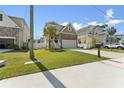 Exterior view of home with well-kept lawn and a concrete driveway at 7509 S Sherrill St, Tampa, FL 33616