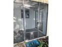 Screened patio with convenient pet door, extending living space while enjoying the outdoors bug-free at 782 Village Lake N Ter # 102, St Petersburg, FL 33716