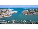 Stunning aerial view of beachfront property with boat docks and picturesque coastal scenery at 936 Pinellas Bayway S # T-5, Tierra Verde, FL 33715