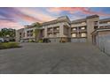 Multi-level condo complex showcasing private balconies, covered parking, and well-maintained landscaping at 936 Pinellas Bayway S # T-5, Tierra Verde, FL 33715