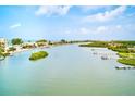 Picturesque water view from the property featuring lush vegetation and docks at 10215 Regal Dr # 41, Largo, FL 33774