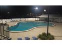 Large community pool with ample seating for residents to relax and enjoy at 126 Philadelphia Blvd # 10, Palm Harbor, FL 34684