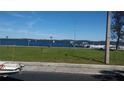 Beautiful waterfront view with boats docked and sailboats in the distance on a clear day at 126 Philadelphia Blvd # 10, Palm Harbor, FL 34684