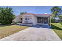 Well-kept single-story home with a carport and covered patio, set on a spacious lot at 35128 Dale Ave, Zephyrhills, FL 33541