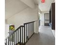 Hallway offers an outdoor feel and a view of surrounding nature at 3600 Magnolia Ridge Cir # 1221-G, Palm Harbor, FL 34684