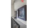 Outdoor hallway offering natural light and a sense of the outdoors at 3600 Magnolia Ridge Cir # 1221-G, Palm Harbor, FL 34684