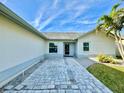 Paver walkway leads to the front entrance of this charming single story home at 3944 102Nd N Pl, Clearwater, FL 33762