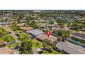 An aerial view showcases the home's location in a lush neighborhood with nearby amenities at 4340 50Th S Ter, St Petersburg, FL 33711