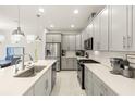 Bright kitchen with stainless steel appliances, a breakfast bar, and ample counter space for cooking at 5733 Colony Glen Rd, Lithia, FL 33547