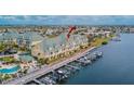 Waterfront condo complex with boat docks and a community pool at 6414 Sunset Bay Cir, Apollo Beach, FL 33572
