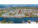 Breathtaking waterfront community showcasing private docks, sparkling pool, and picturesque surroundings, offering serene coastal living at 6414 Sunset Bay Cir, Apollo Beach, FL 33572