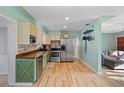 Well-lit kitchen with stainless steel appliances and butcher block countertops at 7690 91St St, Seminole, FL 33777