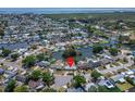 Aerial view of waterfront homes on canals with direct access to the bay and ocean in Bay Crest Park at 8702 Driftwood Dr, Tampa, FL 33615