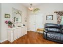 Entryway with hardwood floors, elegant console table, and plenty of natural light at 9229 Dayflower Dr, Tampa, FL 33647