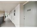 Hallway showing the entrance to unit 208 at 9945 47Th N Ave # 208, St Petersburg, FL 33708