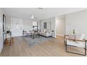 Bright living room with neutral tones, modern furnishings and ample natural light at 13810 Malcolm Ave, Hudson, FL 34667