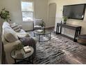 The well-lit living room offers hardwood floors, tasteful decor, and an open layout for easy living at 1419 55Th S St, Gulfport, FL 33707