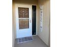 Welcoming entryway with decorative door, neutral paint, and a cute 'welcome' sign at 3400 Gulf Blvd # 102, Belleair Beach, FL 33786
