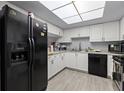 Bright kitchen features a full suite of appliances and tile flooring at 3709 Greenery Ct # 209, Tampa, FL 33618