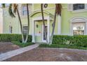 Charming entrance featuring neatly manicured landscaping and a brick walkway leading to the front door at 5102 Coquina Key Se Dr # D, St Petersburg, FL 33705