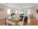 Bright living room with hardwood floors, dining area and sliding glass doors opening to the outdoors at 1008 S Armenia Ave # A, Tampa, FL 33629