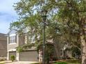 Exterior view of a two-story home, showcasing its architectural style, landscaping, and curb appeal at 10121 Westpark Preserve Blvd # 10121, Tampa, FL 33625