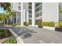 Elegant condo entrance with lush planters and modern architectural details at 175 1St S St # 2603, St Petersburg, FL 33701