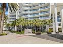 Contemporary condo entrance with palm trees and manicured landscaping at 175 1St S St # 2603, St Petersburg, FL 33701